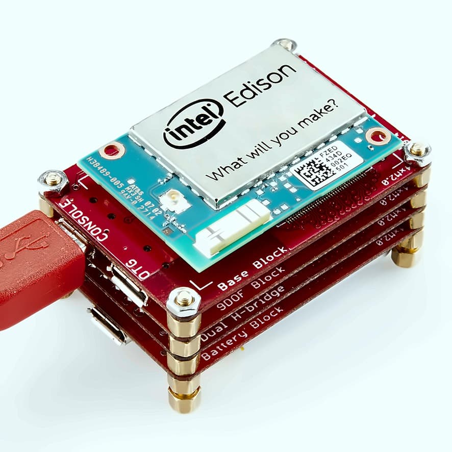 An Edison module on a stack of four SparkFun blocks, labelled Base, 9DOF, Dual H-bridge and Battery, held together with standoffs